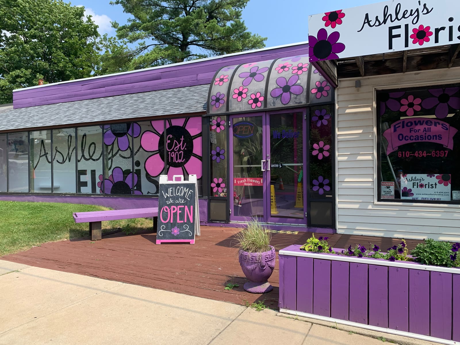 Ashley's Florist storefront on Hanover Avenue in Allentown, PA with purple awning and flower displays